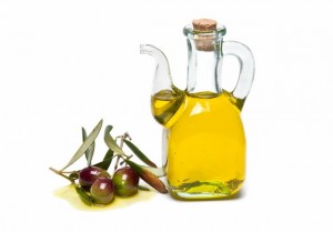 Glass container with olive oil.